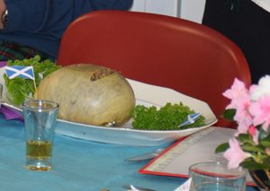 Photo of haggis dish and a glass of whiskey